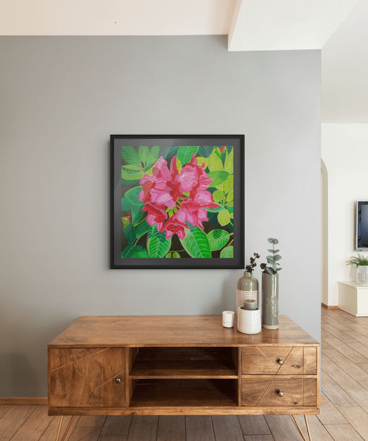 Éclat de Rhododendron expressive floral artwork by Nelleke Bruno displayed above a brown sideboard against a white wall, framed in black with a black mat board.