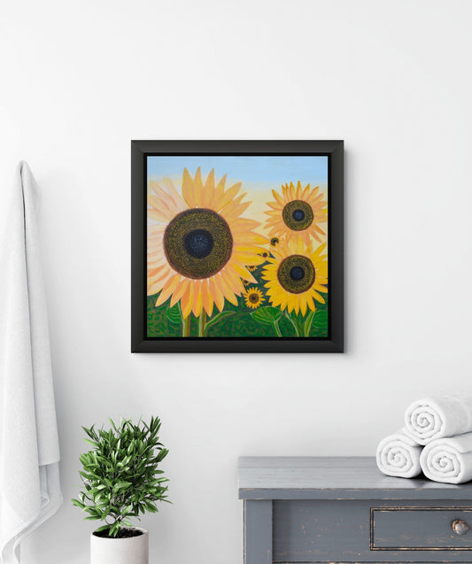 Éclat de Tournesol canvas print by Nelleke Bruno featuring radiant yellow sunflowers beneath a vivid blue sky.