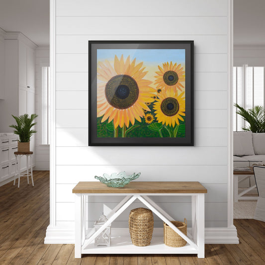 Éclat de Tournesol fine art print styled in an elegant boudoir with a white wall, creating a bright and sophisticated interior with vibrant sunflower artwork.