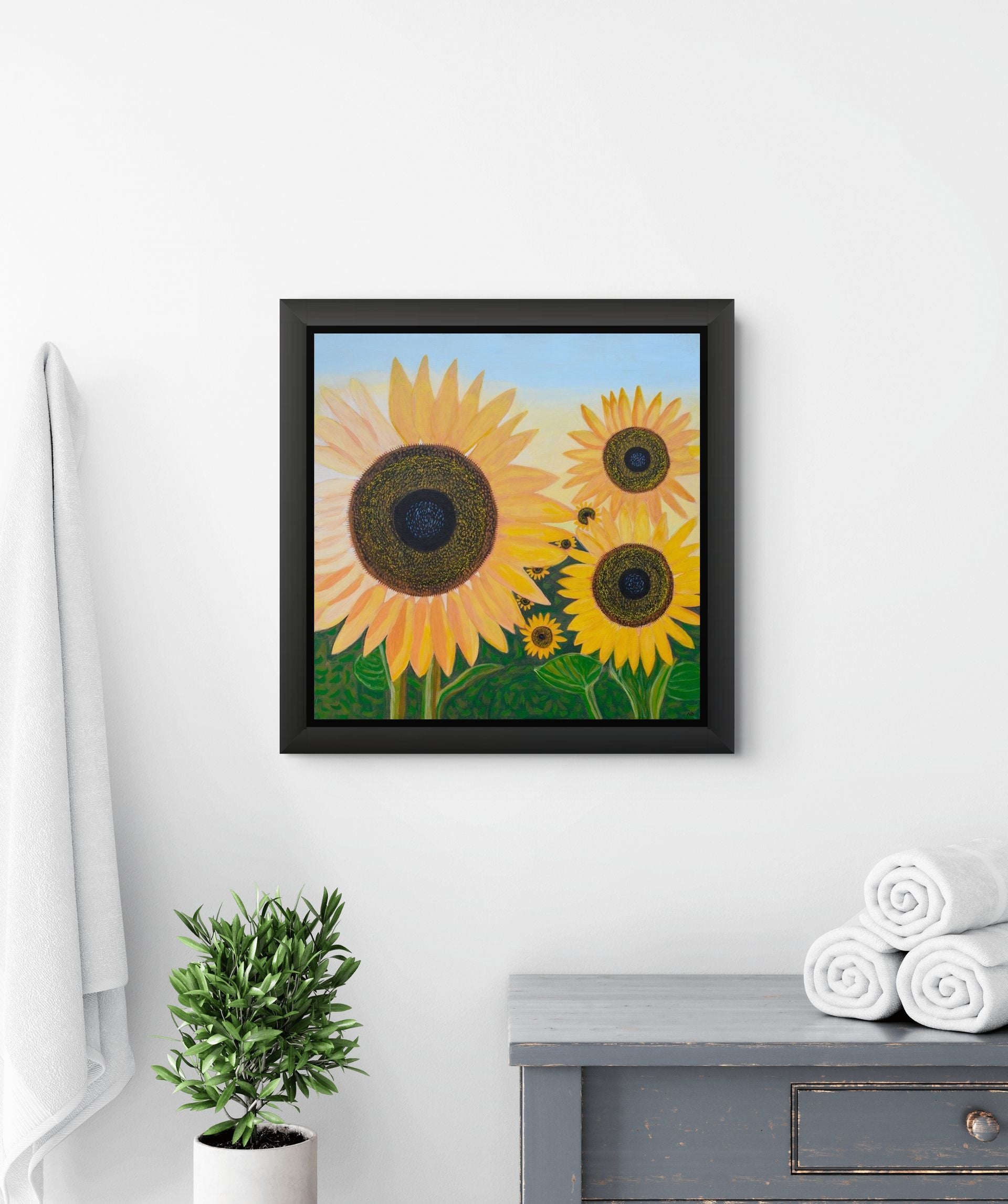 Éclat de Tournesol canvas print by Nelleke Bruno featuring radiant yellow sunflowers beneath a vivid blue sky.