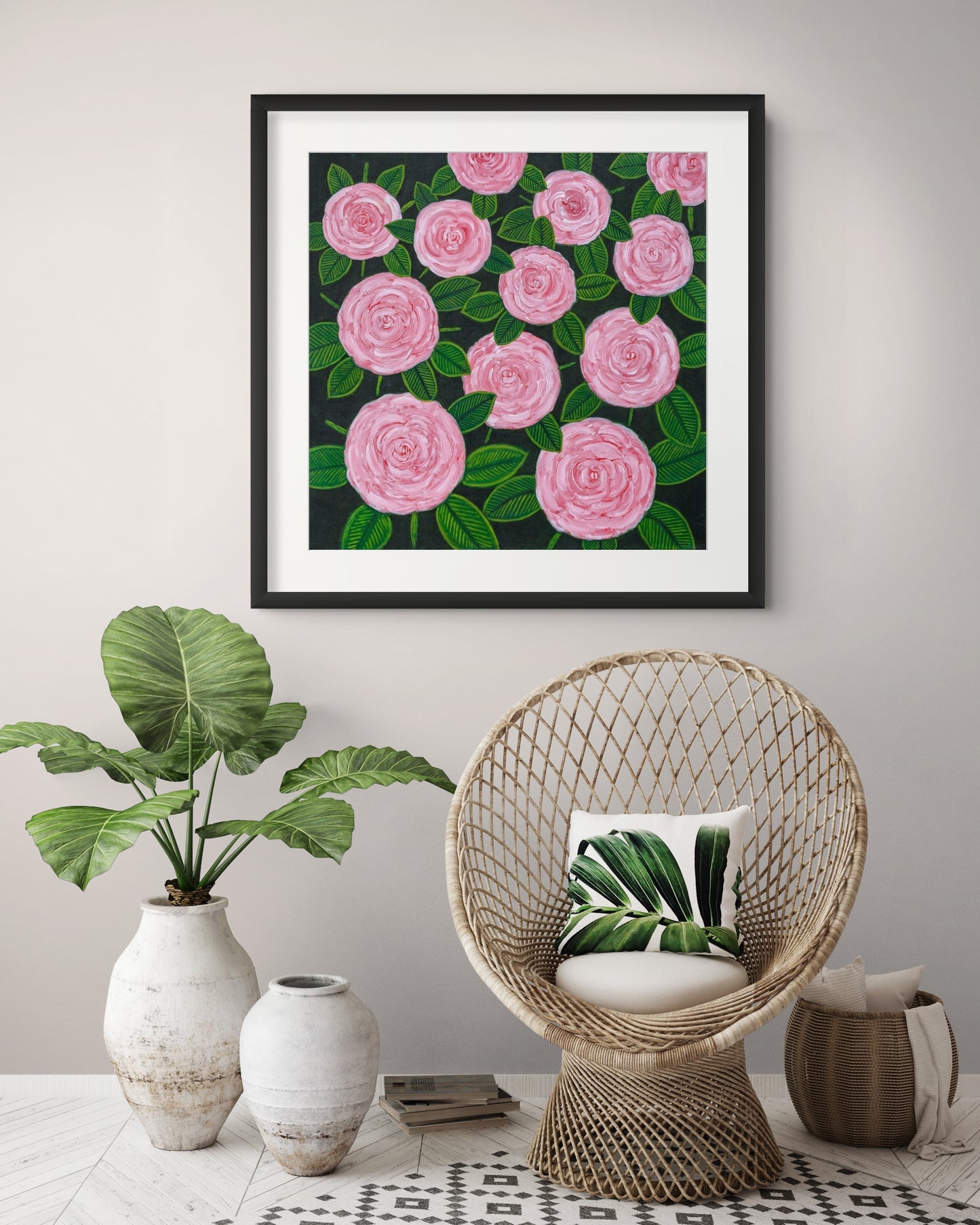 Éclat des Roses fine art print by Nelleke Bruno displayed above a chair with a green plant in a stylish interior, bringing vibrant floral colour and timeless elegance.