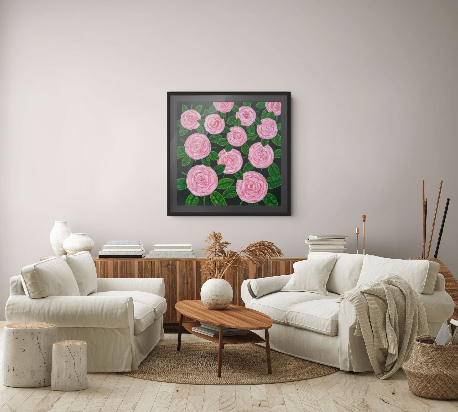 Éclat des Roses floral wall art by Nelleke Bruno displayed above a sofa in a contemporary living room, adding colour, elegance and a French-inspired atmosphere.